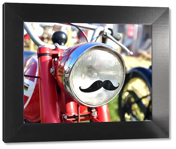 CM25 5237 Motorcycle headlamp with a moustache