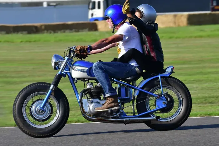 Rights Managed : CJ13 2181 Triumph Motorcycle, rider and pillion passenger Rights Managed : CJ13 2181 Triumph Motorcycle, rider and pillion passenger