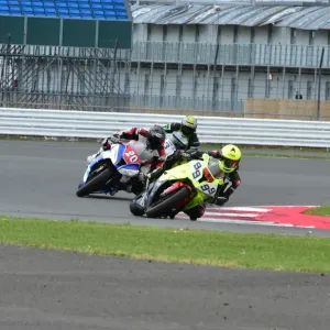 Print of a motorcycle racing scene at Silverstone Print of a motorcycle racing scene at Silverstone