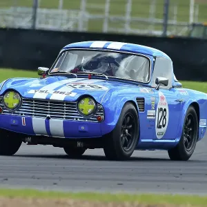 A photograph of a Triumph TR4 racing car, printed on paper A photograph of a Triumph TR4 racing car, printed on paper