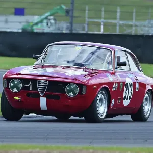 A photograph print of an Alfa Romeo Giulia Sprint GT racing at Silverstone A photograph print of an Alfa Romeo Giulia Sprint GT racing at Silverstone
