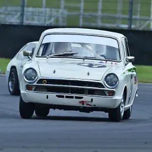 A print of a Ford Lotus Cortina Mk1 in racing action at Silverstone A print of a Ford Lotus Cortina Mk1 in racing action at Silverstone