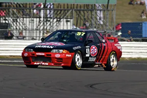 Prints of A hint of exhaust flames, Simon Garrad, Nissan Skyline R32, An impressive grid for the Tony Dron Memorial Trophy for MRL Historic Touring Cars, a 45 minute race on the full Grand Prix circuit The Classic Silverstone August 2022 Prints: CJ11 8262 Simon Garrad, Nissan Skyline R32