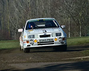 <b class=qtipBold><figcaption>CM26 7447 Ford Sierra RS Cosworth</figcaption></b><br>Ford Sierra RS Cosworth, Race Retro, Rally stage, Sunday 24th February, 2019, retro, nostalgia, motorsport, cars, vehicles, racing, classic cars, historic cars, nostalgia, vehicles, cars, rallying, retro, off road, outside, NAEC, National Agricultural Exhibition Centre, Stoneleigh Park, Warwickshire, England,<br><em>© 2019 Chris McEvoy, www.cjm-photography.co.uk, all rights reserved</em> CM26 7447 Ford Sierra RS Cosworth