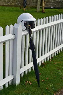 Motorsport galleries/motorsport 2021 goodwood 78th members meeting october 2021/cm32 0366 racing helmet umbrella fence Motorsport galleries/motorsport 2021 goodwood 78th members meeting october 2021/cm32 0366 racing helmet umbrella fence